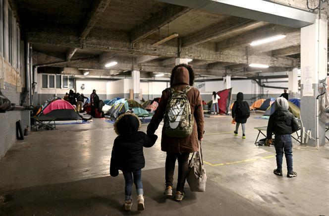 A parking lot used as an emergency shelter by Utopia 56 association, near the Arc de Triomphe, Paris, March 1, 2023.
