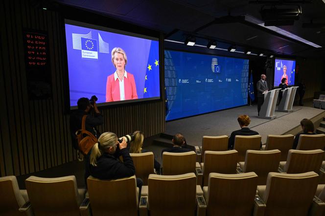 European Council President Charles Michel (at the podium) and European Commission President Ursula von der Leyen (on the screen) at a press conference in Brussels on October 17, 2023.