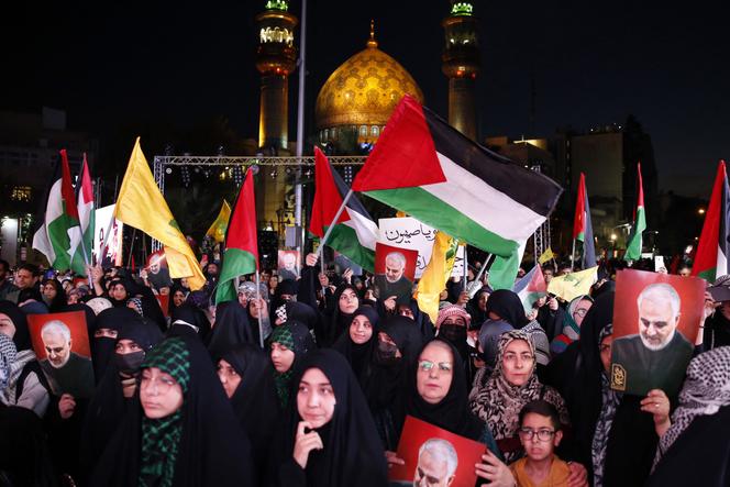 Demonstrators wave the flags of Palestine and the Lebanese Shiite movement Hezbollah during a protest in Tehran in support of Palestinians in the Gaza Strip on October 20, 2023, amid the ongoing battles between Israel and the Palestinian group Hamas.