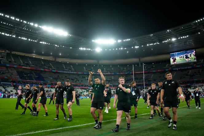 Members of the New Zealand team celebrate on the pitch after the end of the Rugby World Cup semifinal match between Argentina and New Zealand at the Stade de France in Saint-Denis, outside Paris, Friday, Oct 20, 2023.