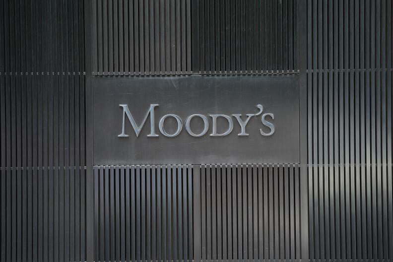 A sign for Moody's rating agency is displayed at the company headquarters in New York, September 18, 2012. AFP PHOTO/Emmanuel Dunand (Photo by EMMANUEL DUNAND / AFP)