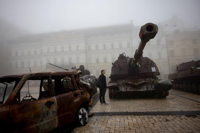 A man looks at destroyed Russian military vehicles outside St. Michael's Golden-Domed Monastery on a foggy morning, amid Russia's attack on Ukraine, in Kyiv, Ukraine October 21, 2023.