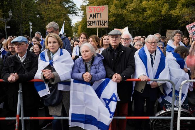 People listen to speeches during a demonstration against antisemitism and to show solidarity with Israel in Berlin, Germany, Sunday, October 22, 2023.