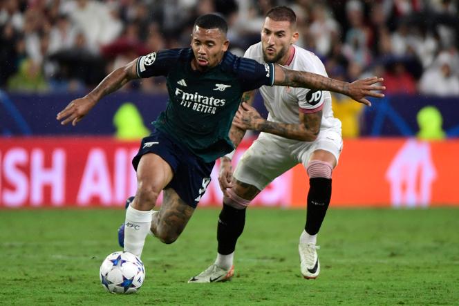Arsenal's Brazilian forward #09 Gabriel Jesus (L) is challenged by Sevilla's Serbian midfielder #06 Nemanja Gudelj during the UEFA Champions League 1st round day 3 Group B football match between Sevilla FC and Arsenal at the Ramon Sanchez Pizjuan stadium in Seville on October 24, 2023.