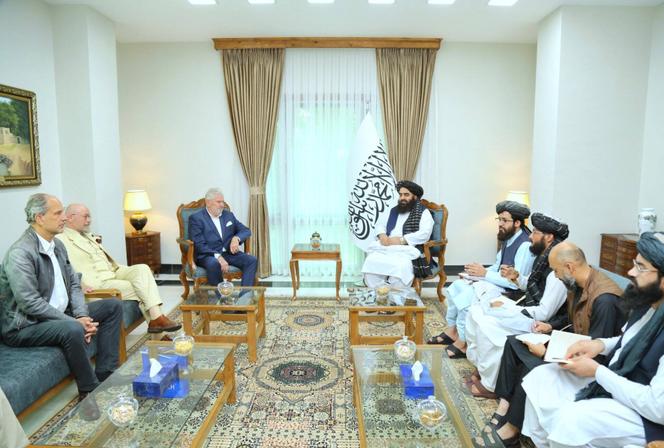 Members of the Freedom Party of Austria (left), Afghan Foreign Minister Mawlawi Amir khan Muttaqi (center, right) and members of his cabinet, in Kabul, September 24, 2022.