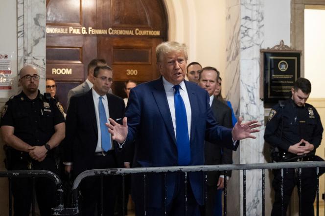 Former President Donald Trump speaks to the media as he exits the courtroom in his civil business fraud trial at New York Supreme Court, Wednesday, Oct. 25, 2023, in New York.