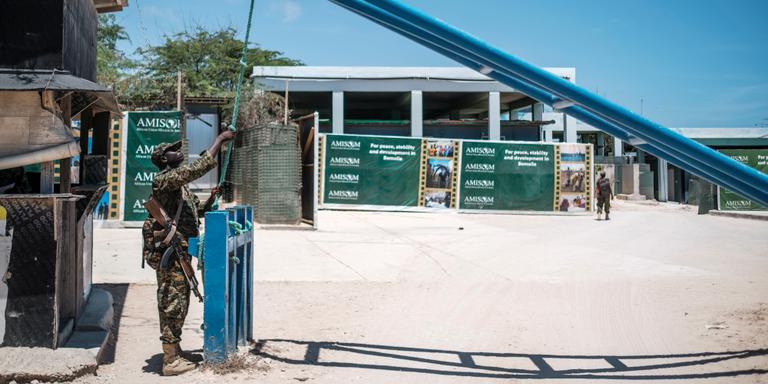 EDUARDO SOTERAS FOR LE MONDE An Ugandan soldier opens a gate at the headquarters of the African Union Transition Mission in Somalia (ATMIS), in the city of Mogadishu, Somalia, on October 16, 2023.