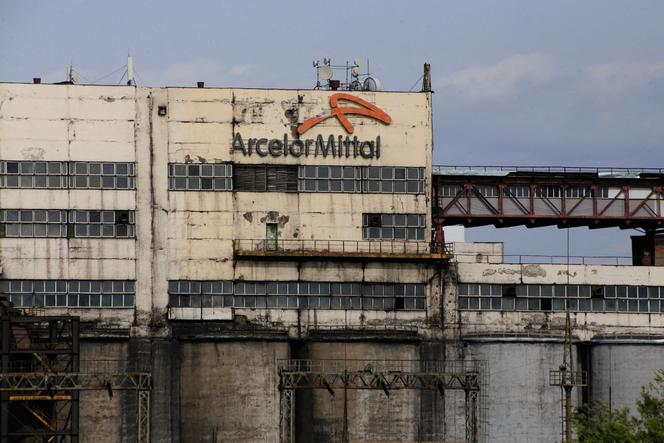 The logo of ArcelorMittal, a Western steel giant, is seen on a mine building in the industrial town of Shakhtinsk on September 9, 2023. 
