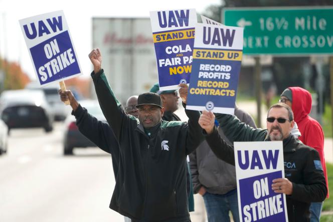 United Auto Workers members walk the picket line during a strike at the Stellantis Sterling Heights Assembly Plant, in Sterling Heights, Michigan, Monday, October 23, 2023. 