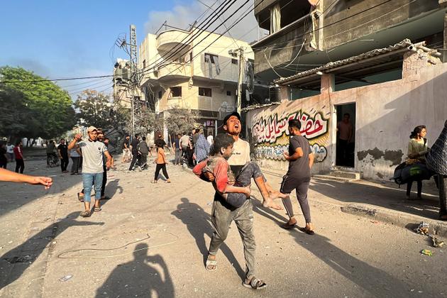 An injured child near the site of Israeli strikes on homes in Gaza City, October 28, 2023.
