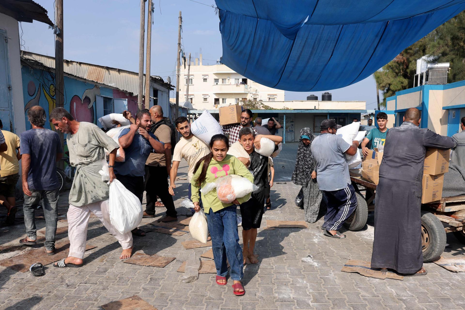 Distribution of provisions to displaced families at the UN-run humanitarian supply center in Deir Al-Balah, Gaza Strip, October 28, 2023.