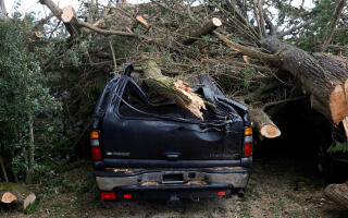 Tree branches on a damaged car during Storm Ciaran in Clohars-Carnoet, Brittany, France, November 2, 2023. REUTERS/Stephane Mahe