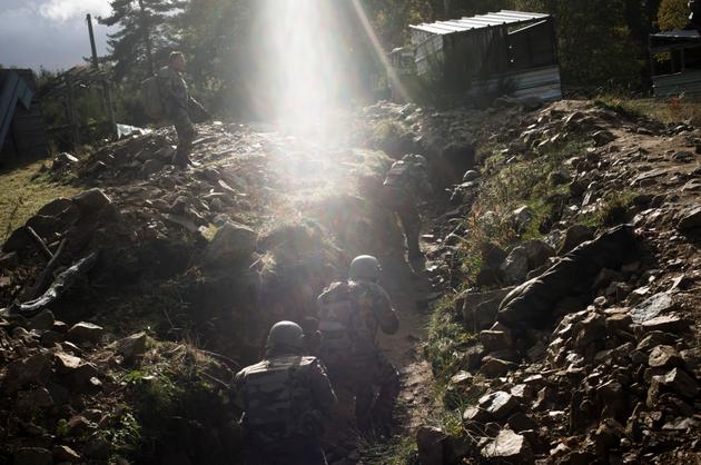 Ukrainian soldiers training in France, November 2023. Ukrainian soldiers (in the trench in French uniforms) are being evaluated, under the observation of French instructors (standing above the trench).