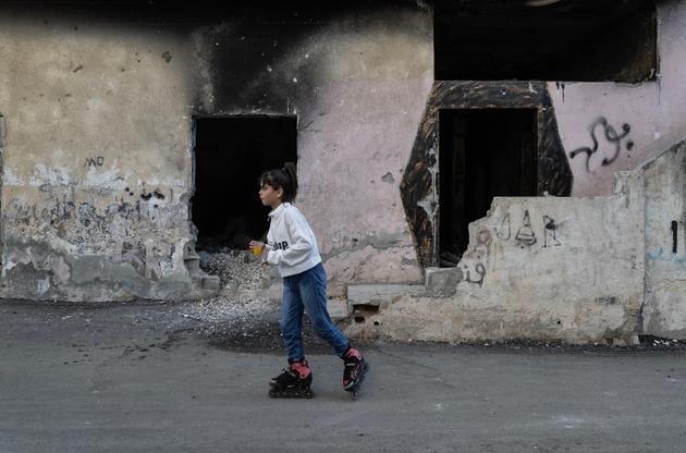 In front of a house destroyed by fighting in July, in the Jenin refugee camp in the West Bank on October 7, 2023.