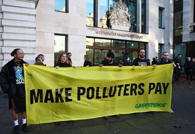 Environmental and climate change activists demonstrate outside of Westminster Magistrates Court in London on November 15, 2023.
