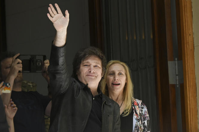 Javier Milei greets his supporters, alongside his sister Karina Milei, in Buenos Aires, November 19, 2023.