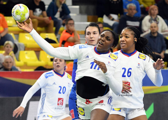 France's Pauletta Foppa (right) and teammate Grace Zaadi, who shoots the ball, during the preliminary round match between Romania and France at the 2022 European Women's Handball Championship, in Skopje, Macedonia, November 7 2022.
