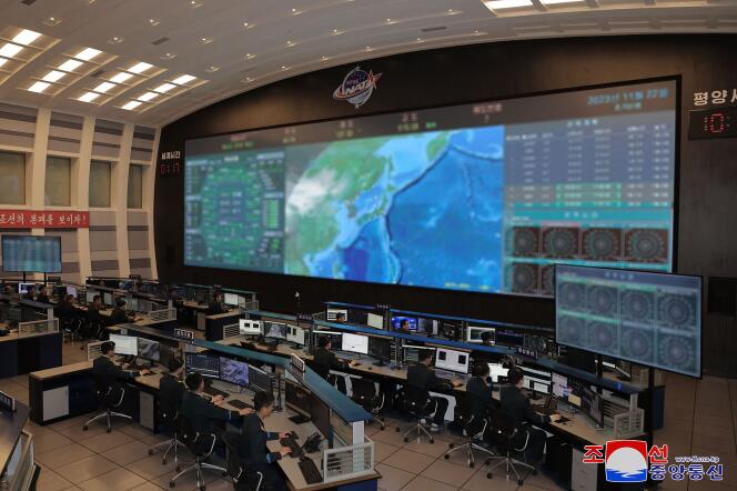 At the control center of the North Korean space agency, November 22.  Photo broadcast by the official KCNA agency. 