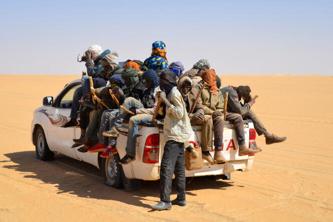 Migrants, mainly from Niger and Nigeria, board a van in northern Niger, heading to the Libyan border post of Gatrone, January 22, 2019.