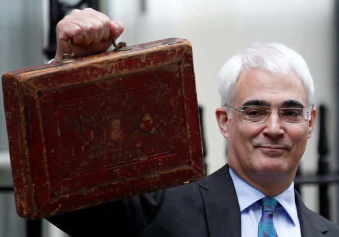 Britain's Chancellor of the Exchequer, Alistair Darling, carries Gladstone's old budget box before presenting the annual budget to the House of Commons in London, March 24, 2010.  