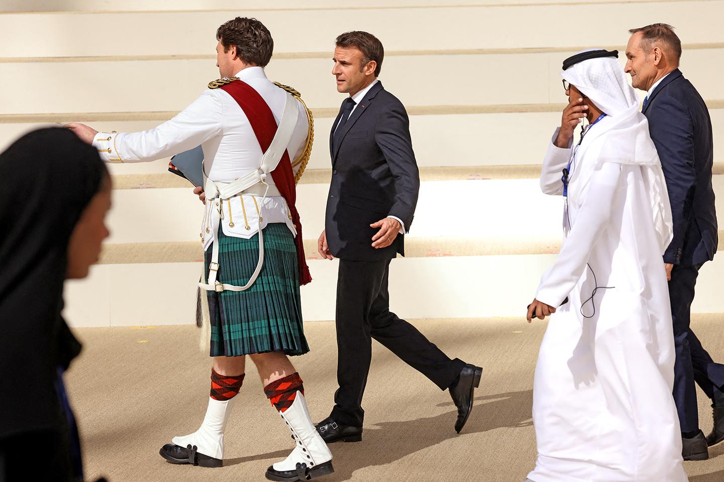 Emmanuel Macron on the move at COP28