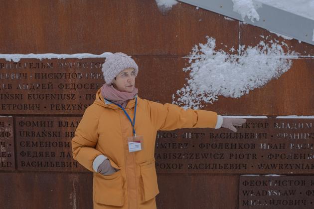 Irina Popovitch, an employee of the memorial complex, leads a tour of the Katyn forest in Russia, where Polish officers and victims of Soviet political repression were executed, on December 2, 2023.