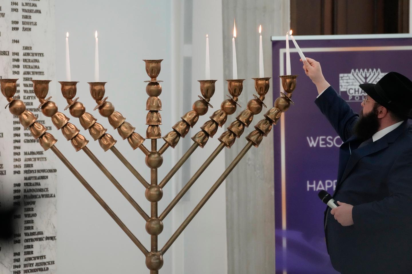 Polish far-right MP snuffs out Hanukkah menorah with fire extinguisher