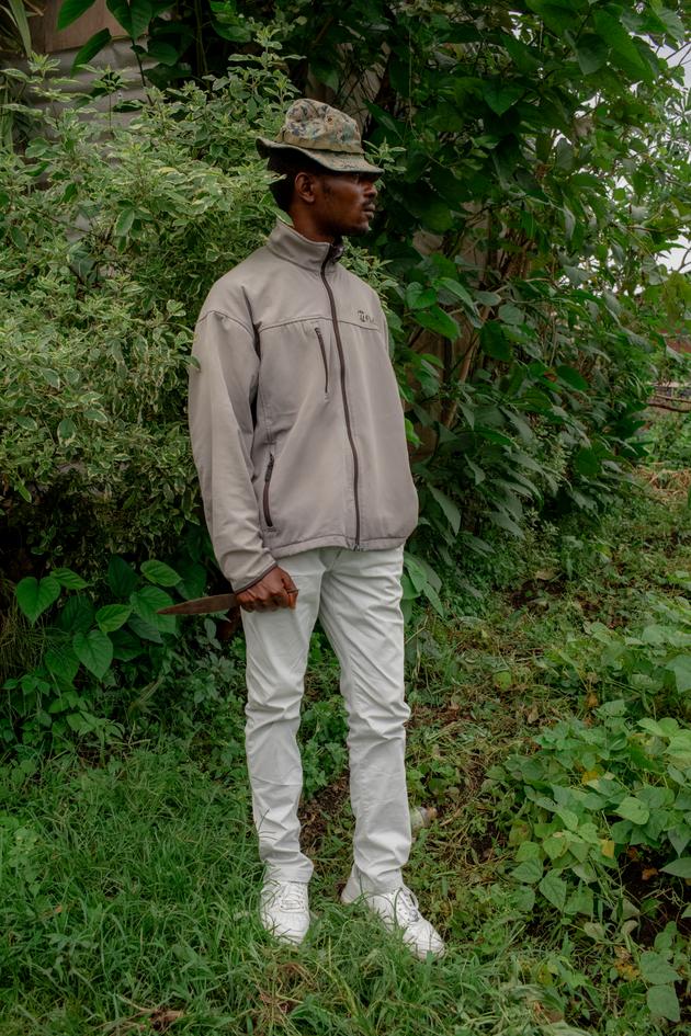 Patrick, 38, a member of the FAR armed group, patrols the Buhene district of Goma on November 30, 2023.