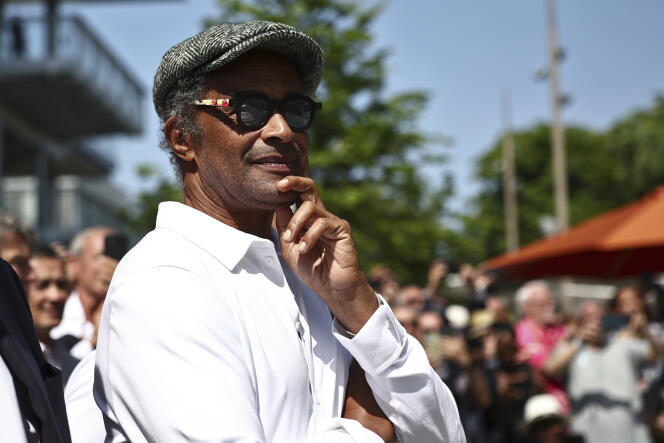 Former French tennis player and singer Yannick Noah looks on during the inauguration of a fresco retracing his life, on the 40th anniversary of his victory at Roland Garros in 1983, on day one of the Roland-Garros Open tennis tournament in Paris Sunday, May 28, 2023.