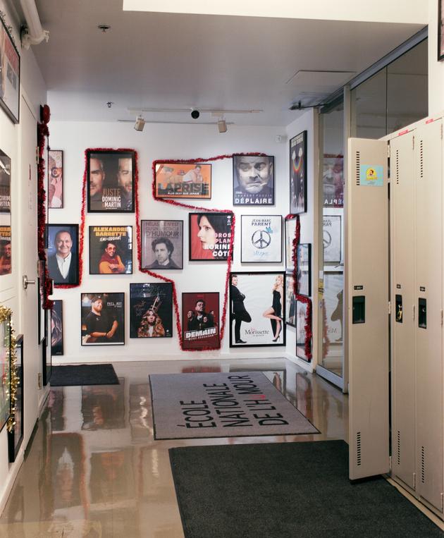 At the school entrance, posters of its alumni on display.