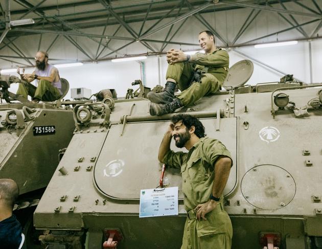 Reservists from the Yasham 179 battalion attend a stand-up show at the Israeli military base of Nahshonim, on the demarcation line between Israel and the West Bank, on November 9, 2023.