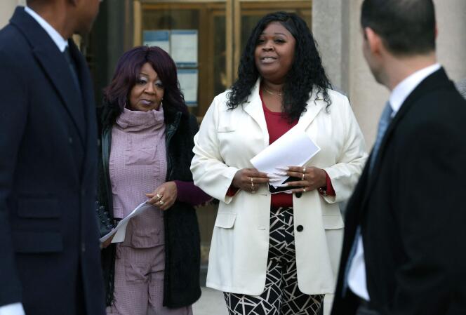 Ruby Freeman (left) and her daughter Vandrea Shay Moss leave a courthouse in Washington on December 15, 2023.