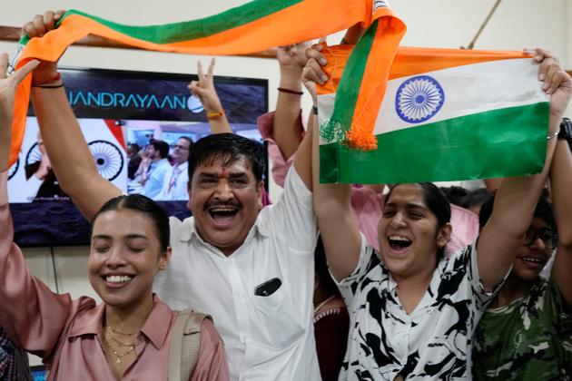 Indians celebrate the successful landing of Chandrayaan-3, Sanskrit for "moon craft," at the Nehru Planetarium in New Delhi on August 23, 2023.