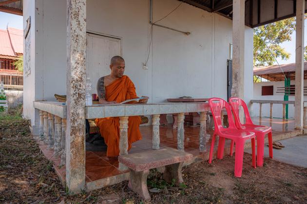 Bunthom Phankong studies Buddhist texts at the Samakkhi Phatthanaram "wat" near his family home, on December 15, 2023, in Udon Thani, Thailand.