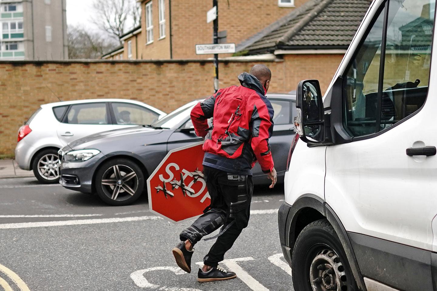 Police arrest second man after Banksy stop sign theft in London