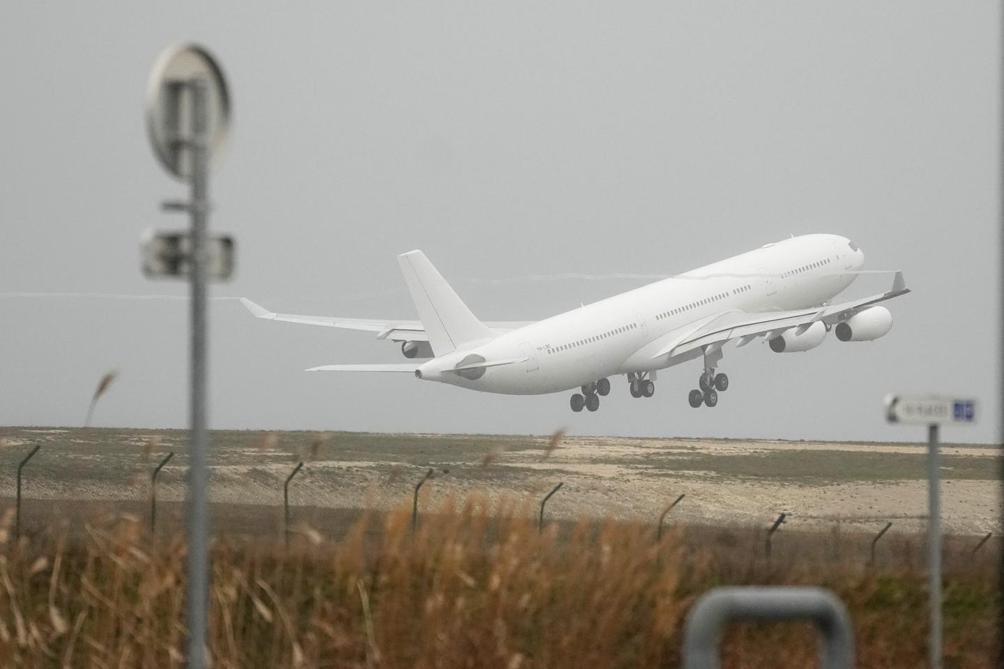 India investigates people smuggling after return of plane halted in France