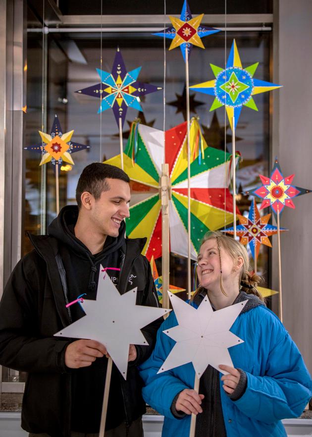 Anton, 22, from Kharkiv, and his girlfriend, Oleksandra, 23, from Donetsk, at the National Museum of Ukrainian History in Kyiv on December 23, 2023. The couple bought two Christmas stars to organize koliadkas (Christmas choirs) and raise funds for a Ukrainian battalion. Oleksandra had grown up with koliadkas, unlike Anton, for whom this is a first. "We're trying to revive traditions: the stars symbolize the star announcing the birth of Jesus in Bethlehem," they explained.