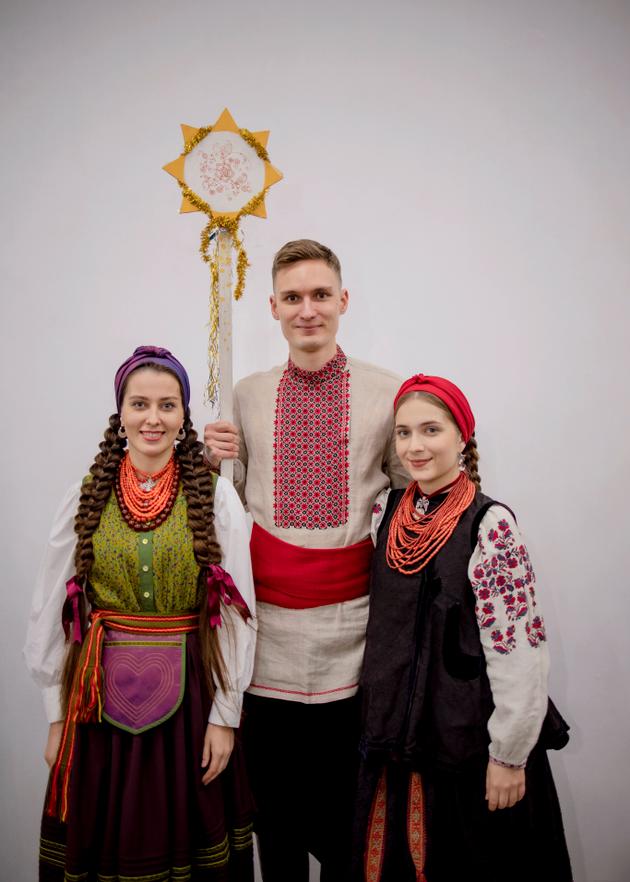 Ihor Didenchuk, 24, from Lutsk, with his girlfriend and a friend, in Kyiv on December 24, 2023. Didenchuk began playing the traditional flute at the age of 6. In 2021, he was selected with his group Go-A for the Eurovision Song Contest and has collaborated with the famous Ukrainian group Kalush. For several years now, he has been collecting and recording ancient Ukrainian songs in the country's villages for a project to preserve and pass on the oral heritage.
