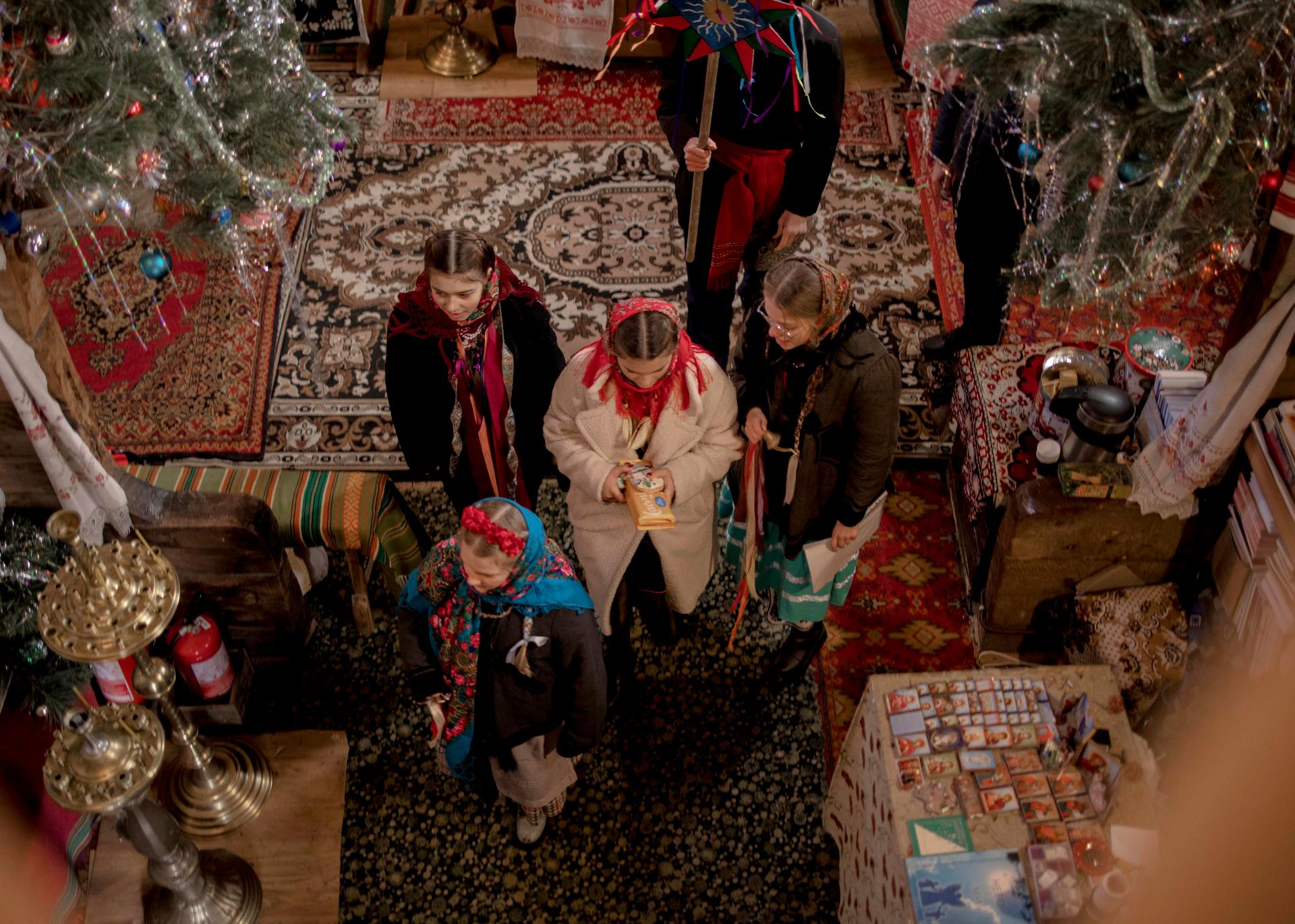 A group of young Ukrainians in a traditional church in Pyrohiv, on the outskirts of Kyiv, on December 25, 2023. For the first time in its history, Ukraine celebrates Christmas on December 25, according to the Julian calendar, instead of January 7.