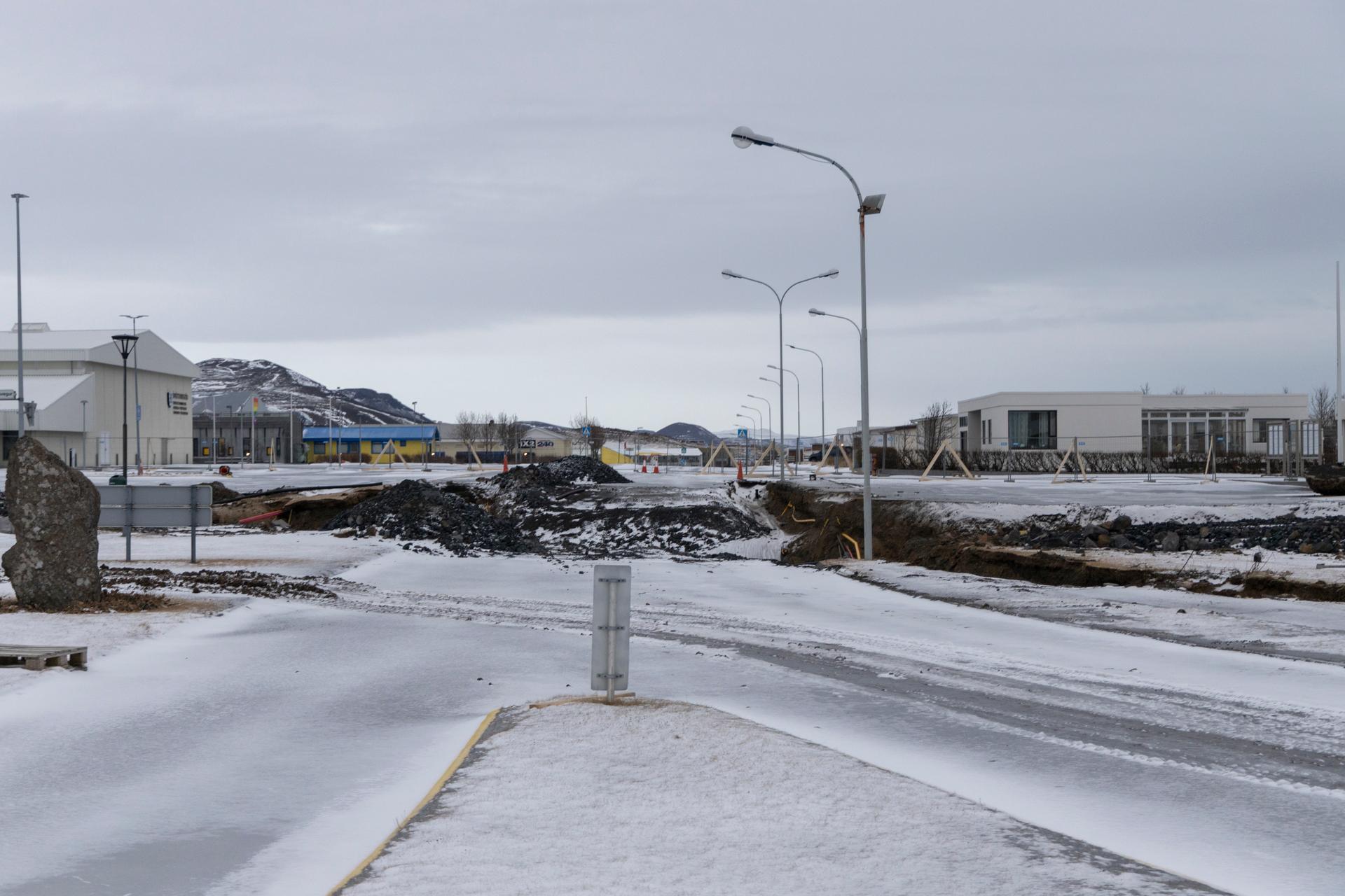 The rift that runs diagonally across the city from the eruption site to the ocean has caused extensive damage at the intersection of Austurvegur and Ranargata streets in Grindavik, Iceland, December 23, 2023.