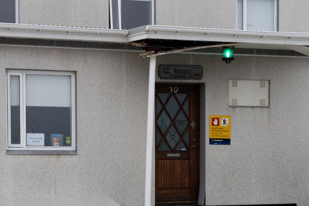Exterior of a house damaged in the November 10, 2023 earthquake, at 30 Vikurbraut Street, with a sign indicating that access to Grindavik, Iceland, is forbidden. December 23, 2023.