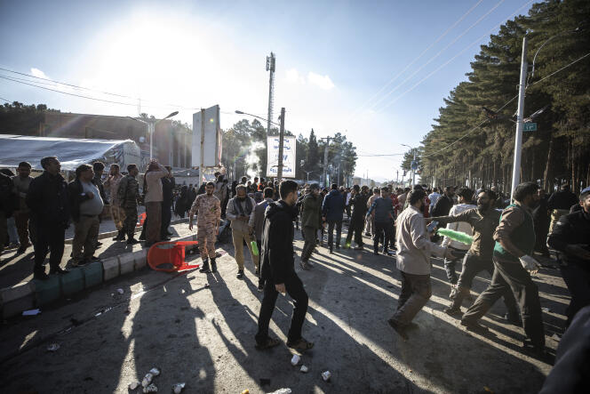 People evacuate after twin explosions near the grave of General Qassem Soleimani, who was killed in 2020, in Kerman, Iran, on January 3, 2024.