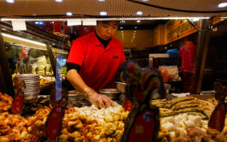 A staff prepares for food at a shop in Taipei, Taiwan January 8, 2024. REUTERS/Ann Wang