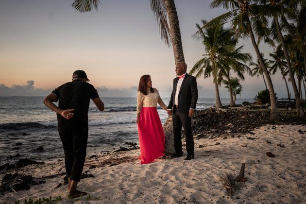 A couple has their wedding photos taken along the beach at Sada, where the new Galawa Hotel is under construction.