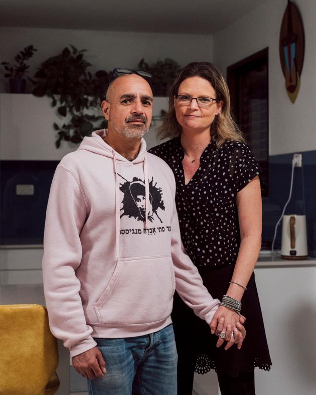 Michal Feldon, a pediatrician at Shamir Hospital, and his partner, Yigal Rambam, a teacher and activist, at home in Tel Aviv on January 10, 2024.