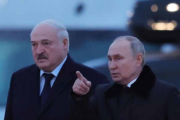 Russian President Vladimir Putin (R) and his Belarusian counterpart Alexander Lukashenko during a ceremony marking the 80th anniversary of the end of the Siege of Leningrad in the village of Zaitsevo, Russia, on January 27, 2024.