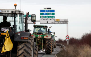 French farmers use their tractors during a go-slow operation near Roissy Charles-de-Gaulle airport as they protest over price pressures, taxes and green regulation, grievances shared by farmers across Europe, in Compans, near Paris, France, January 27, 2024. REUTERS/Benoit Tessier