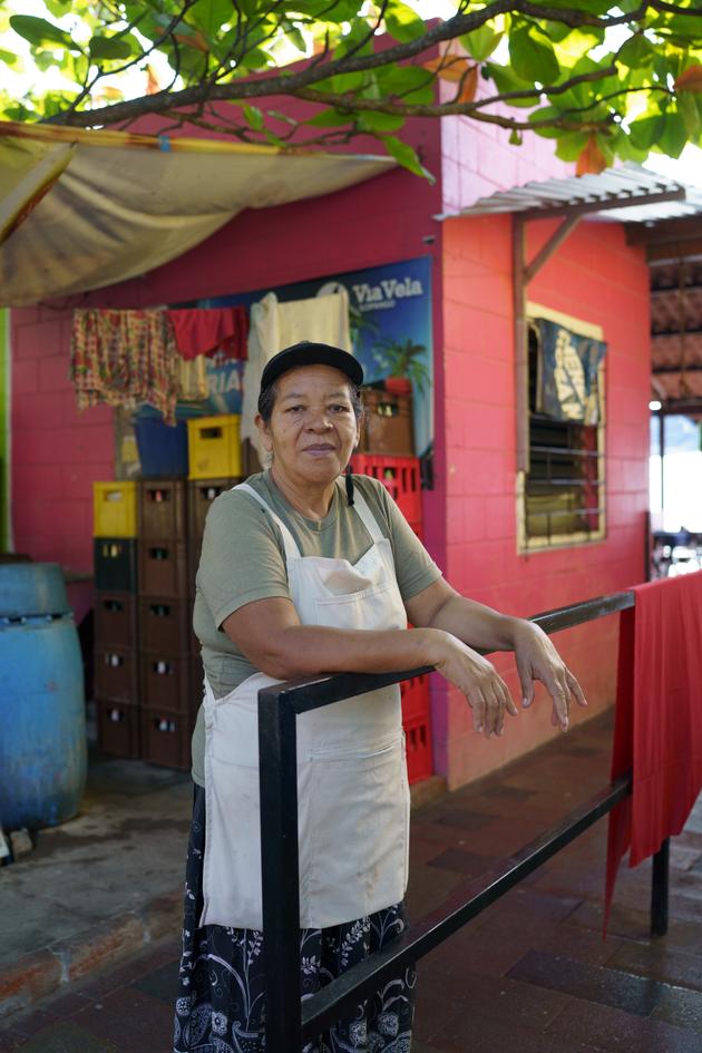Concepcion Lopez, 64, next to her restaurant on Lake Ilopango, in El Salvador, on January 16, 2024.