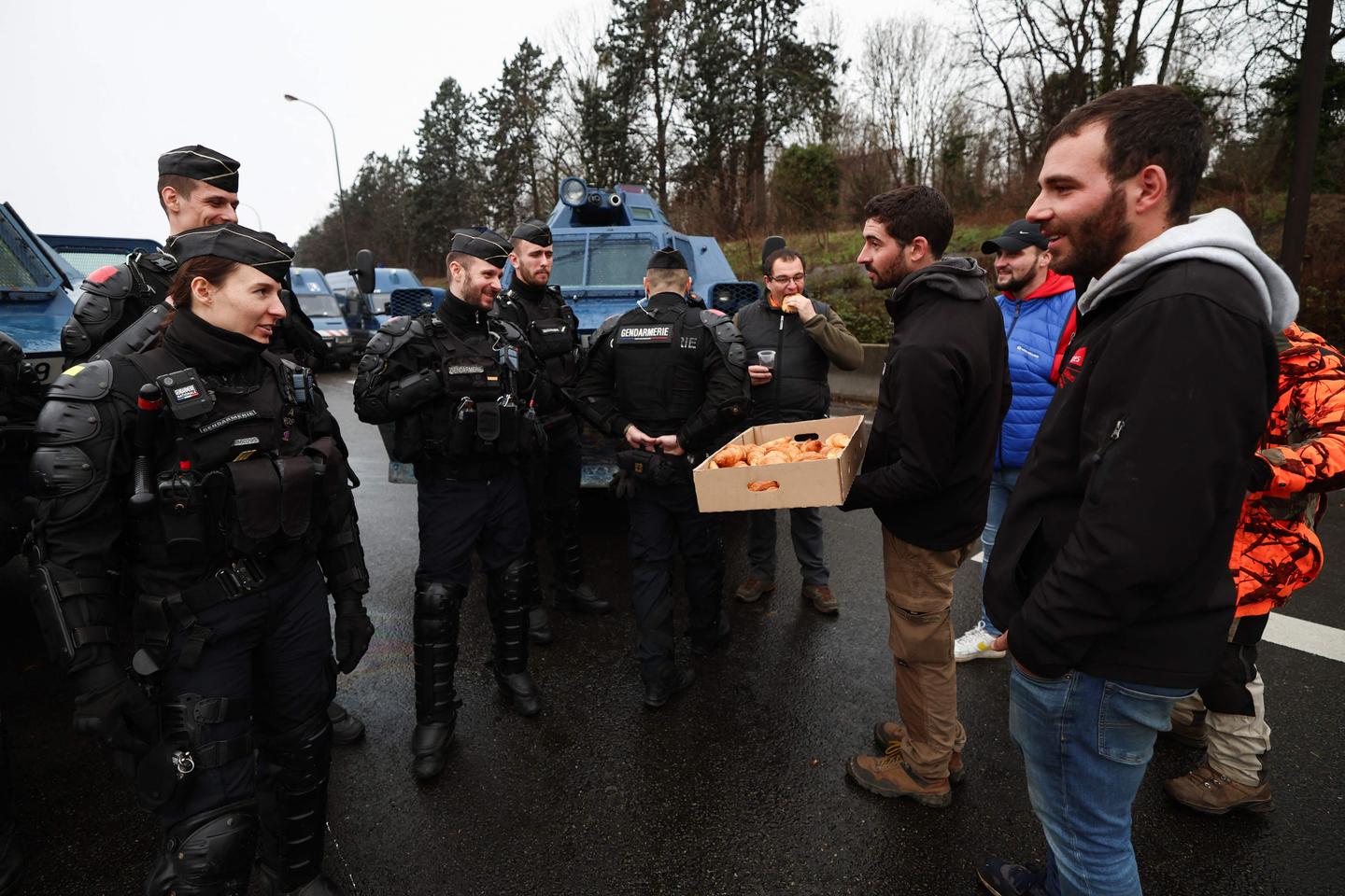 French farmers defiantly maintain their barricades