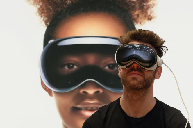 A customer tries to use an Apple Vision Pro headset at an Apple Store in New York on February 2, 2024.